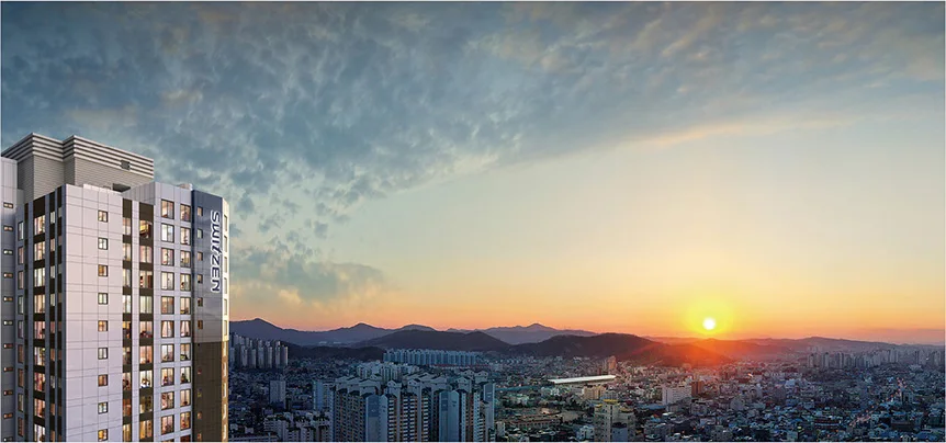 아산 벨코어 스위첸 단지 전경 CG - 고층부 너머로 해가 지는 아산 시가지 조망
